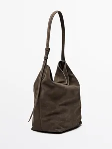 Borsa a secchiello in scamosciato elegante per donna, borsa a spalla retro con tracolla.