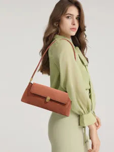 Retro vintage suede shoulder bag for women, elegant underarm bag with metal lock.