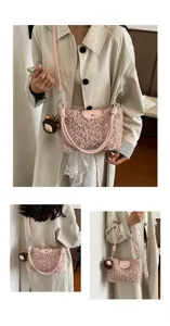 Detailed view of women pink fuzzy crossbody sherpa bag with leather strap and cute plush charm.