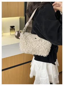 Detail view of a cozy lamb wool crossbody bag for women, featuring a soft plush texture.