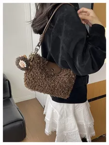 Brown sherpa plush crossbody bag for women, stylish cute teddy shoulder handbag with doll.