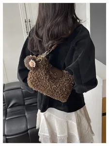 Sherpa crossbody bag for women, fluffy winter shoulder purse with cute plush charm pendant.