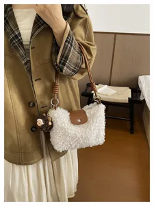 Women's fluffy shearling crossbody bag, cute winter shoulder handbag with brown leather flap.