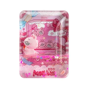 Aimant de réfrigérateur en acrylique avec sable mouvant liquide et design de lapin rose mignon.