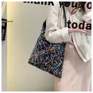 Colorful sequin shoulder bag detail, stylish underarm handbag display showing shimmering multi-color textures.