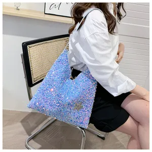 Detail shot of a stylish sparkly sequin shoulder bag for women, trendy chic design.