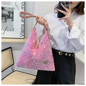 Pink sequin shoulder bag detail, sparkling hobo handbag with zipper and stylish star accent.