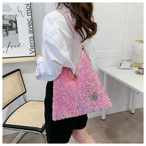 Pink sequin shoulder bag detail view, featuring sparkling rhinestones and shiny paillettes.