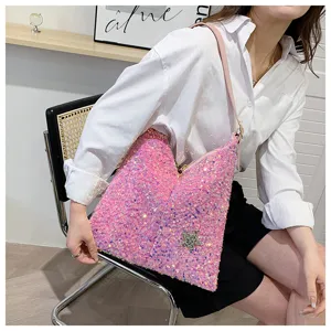 Close-up detail of the pink sequin hobo shoulder bag featuring sparkling star accents.