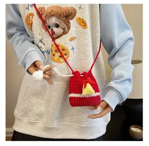Christmas crochet crossbody bag with bell and bow, handmade knit mini shoulder bag for kids.