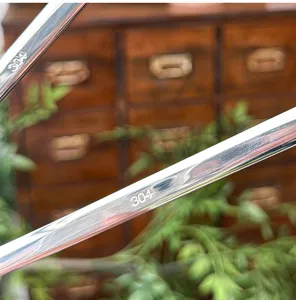 Close up detail of 304 stainless steel cutlery handle, polished surface with laser engraved 304.