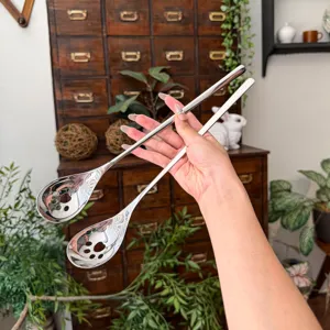 Stainless steel long handle mixing spoon with cat paw design, perfect for coffee and desserts.