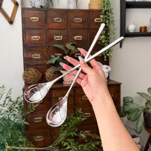Stainless steel long handled mixing spoon for coffee, dessert, and ice cream polished finish.