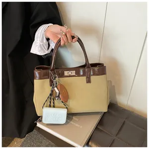 Detailed view of the stylish Maillard style tote handbag with chic charms and contrast trim.