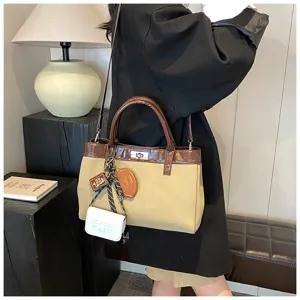Stylish minimalist two-tone handbag for women, casual autumn crossbody tote bag with charms.