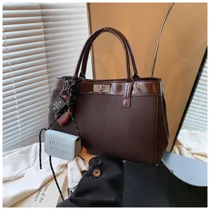 Dark brown leather handbag for women, autumn fashion casual top handle bag with cute mini pendants.