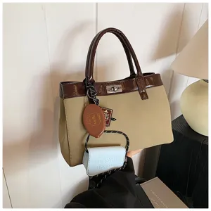 Maillard style minimalist casual handbag detail shot, stylish tote with trendy charms.
