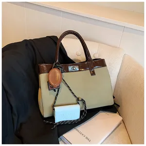 Chic two-tone handbag for women, elegant brown and khaki design with trendy charm accessories.