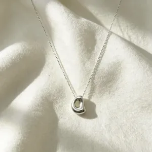 Stunning irregular pebble pendant clavicle chain, sleek silver stainless steel fashion necklace.