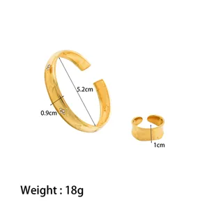 Gold stainless steel diamond cuff bracelet and ring set with size and weight specifications.