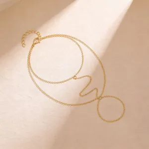 Minimalist gold tone multi layer hand chain bracelet with ring fashion jewelry accessory for women