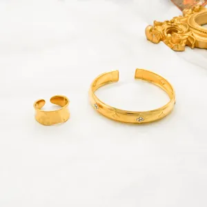 Gold stainless steel open cuff bracelet and ring set with hammered texture and diamond crystals.