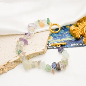 Detail shot of colorful natural stone chip bracelet with gold plated OT clasp bohemian style.