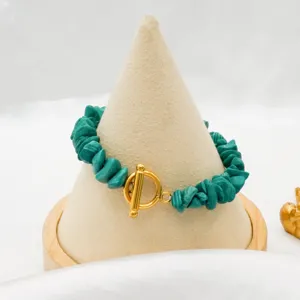 Green irregular chip stone bracelet with gold-plated OT clasp bohemian fashion jewelry detail.