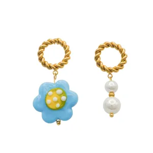 Korean style asymmetric glass flower and pearl drop earrings with twisted gold hoop design.