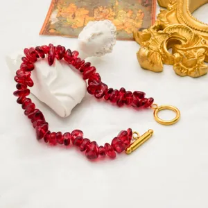 Red irregular chipped stone bracelet detail, gold-plated OT clasp bohemian jewelry.