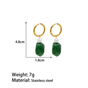 Close detail view of French vintage green resin pearl hoop earrings in stainless steel.
