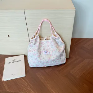 Floral seersucker shoulder bag detail, pink string handle, casual daily commuting tote.