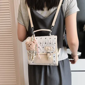 Trendy college style bow print mini backpack with cute bear pendant for casual daily travel.