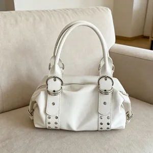 White soft PU leather Boston handbag featuring metal ring buckles and retro underarm style.