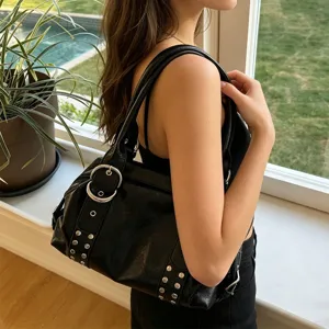 Black PU leather Boston shoulder underarm bag with metal buckles and studded details for women.