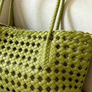 Green woven leather tote bag for summer beach holiday, stylish hollow shoulder handbag.