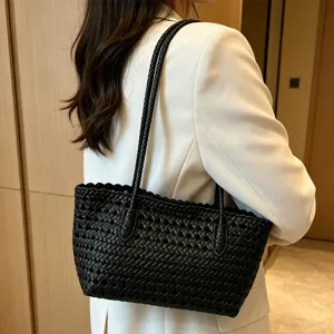 Summer hollow woven beach bag, stylish black shoulder tote for women, casual summer vacation use.