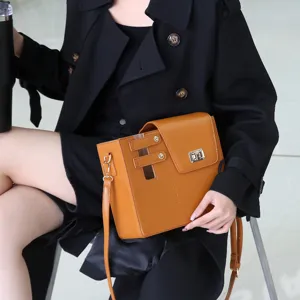 Stylish brown PU leather crossbody bag with built-in tumbler holder for outdoor travel.
