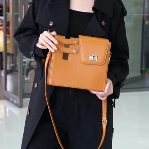 Stylish brown PU leather crossbody shoulder bag with metal twist lock for women daily wear.