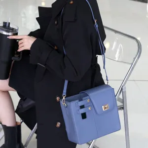 Stylish blue crossbody shoulder bag with flap closure, premium daily carry accessory for outdoor.
