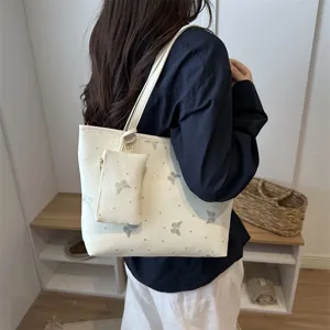 Trendy white tote bag with silver butterfly print, stylish women shoulder bag for daily commute.