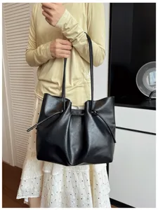 Black pleated PU leather tote shoulder bag detail view, casual commuting fashion design.