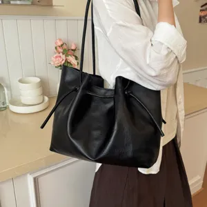 Black PU leather tote bag for women, stylish large capacity shoulder bag for autumn commute.