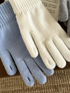 Detailed view of soft knitted winter touchscreen gloves for women, warm and cozy everyday wear.
