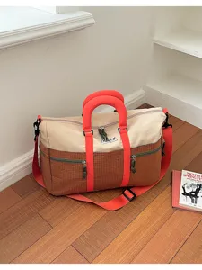 Dopamine color contrast patchwork travel duffel bag with large capacity for gym and sports.