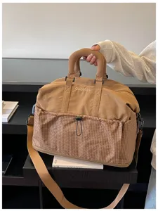 Grosse Reisedüffeltasche, kausale khaki Sporttasche mit Gittertasche und Schulterriemen.