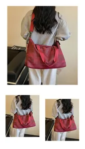 Large capacity travel duffel bag for women, stylish red shoulder bag for weekend trips.