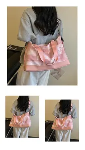 Detailed view of the women's large capacity pink travel duffel bag showing back wear style.
