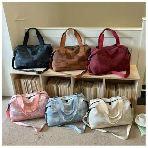 Large capacity travel duffel bag for women, portable waterproof weekender luggage bag for short trips.