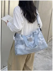 Large travel duffel bag for women, lightweight weekend shoulder and weekender storage bag.